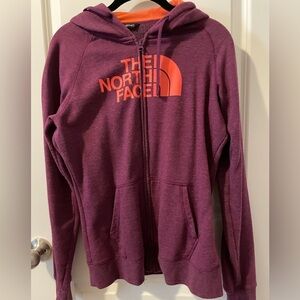 The North Face. Zip-up hoodie. Size medium. Purple with orange lettering